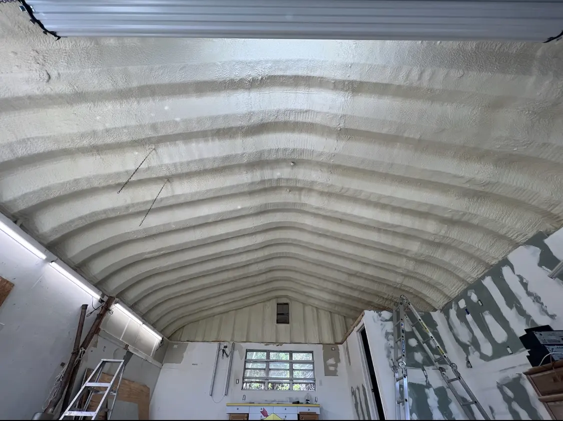 Spray polyurethane foam applied to the underside of a metal roof deck in Cranford